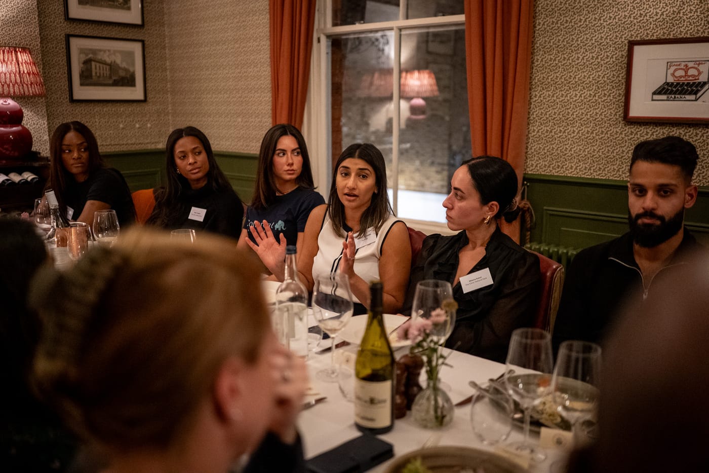 A guest leading a discussion during the Clinic Circle dinner