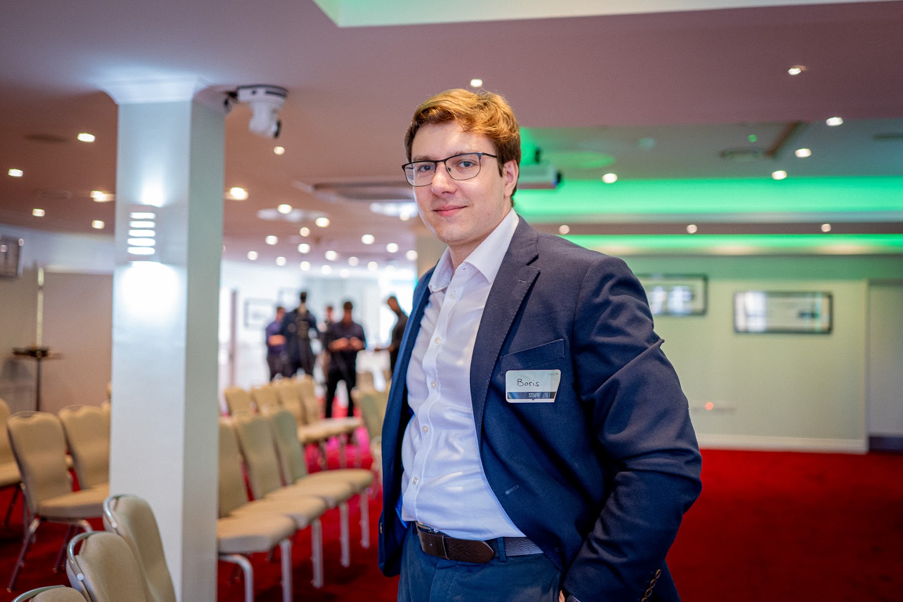 Coherent team member welcoming guests in the event space